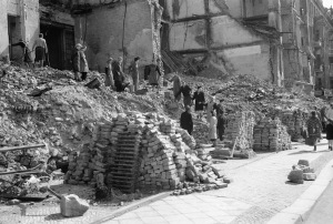 German women put to work by the Russians clear debris and salvage building materials from bomb-damaged buildings along the Kaiserdam in Berlin. RAF Flt Lt N.S. Clark/Imperial War Museum/Wikimedia Commons